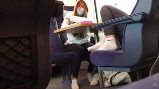 2 teen girls with white sneaker socks feet in german train
