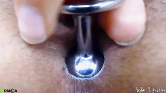Busty Justine punishes her anus with close up
