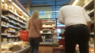 Tight milf behind in jeans shopping with little bend