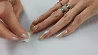 Chick called Fantasynail washes the polish off her long nai