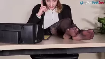 Strawberry Blonde Secretary Shows off Feet while Talking on the Phone