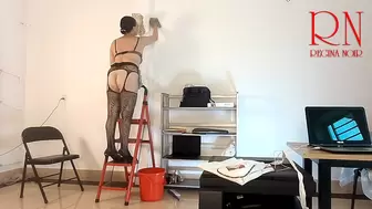 The cleaner maid without panties in the office does tidying up. Wash wall lamp. one
