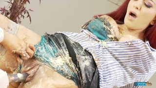Slutty lesbians cover their bodies with food as they rub their clits and pound their cunts with dildo