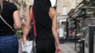 A girl in leggings on the street